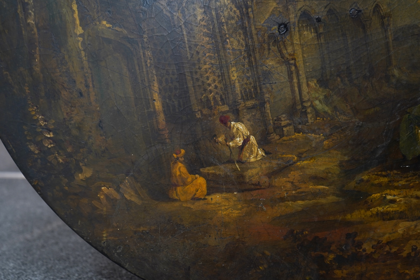 A Victorian japanned table top, depicting Indian grave robbers